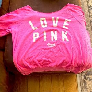 Pink sweatshirt off shoulder